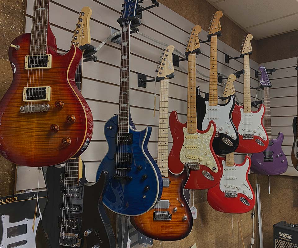 image of electric guitars hanging up in WestSide Music